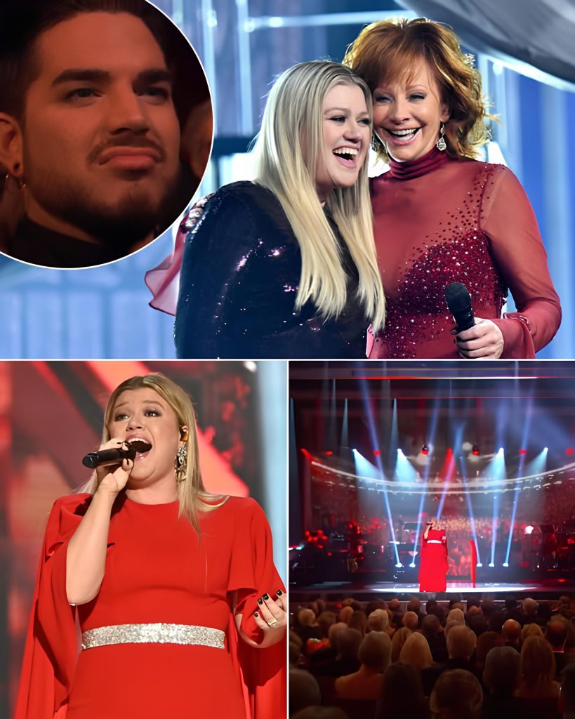 Kelly Clarkson delivered a breathtaking performance to honor her former mother-in-law, the legendary Reba McEntire, leaving the audience in awe and even earning Adam Lambert’s admiration. Recently voted one of the greatest voices in music history, Kelly’s rendition was a testament to her unmatched talent. You could see her fighting back emotion throughout the performance, which made the moment even more powerful—anyone who has ever sung while on the verge of tears knows how incredibly difficult it is to maintain control, yet Kelly nailed every note. The most touching moment came when the audience realized Reba was standing, and in a wave of respect and love, everyone rose to their feet in a standing ovation. This wasn’t just a performance; it was a deeply heartfelt tribute that showcased Kelly’s extraordinary voice and the bond she shares with Reba.